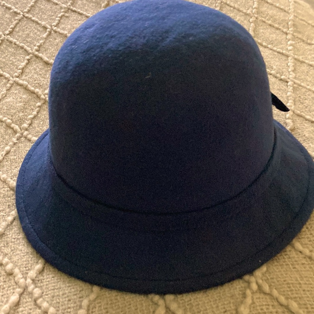 Navy blue hat with decorative flower on the back